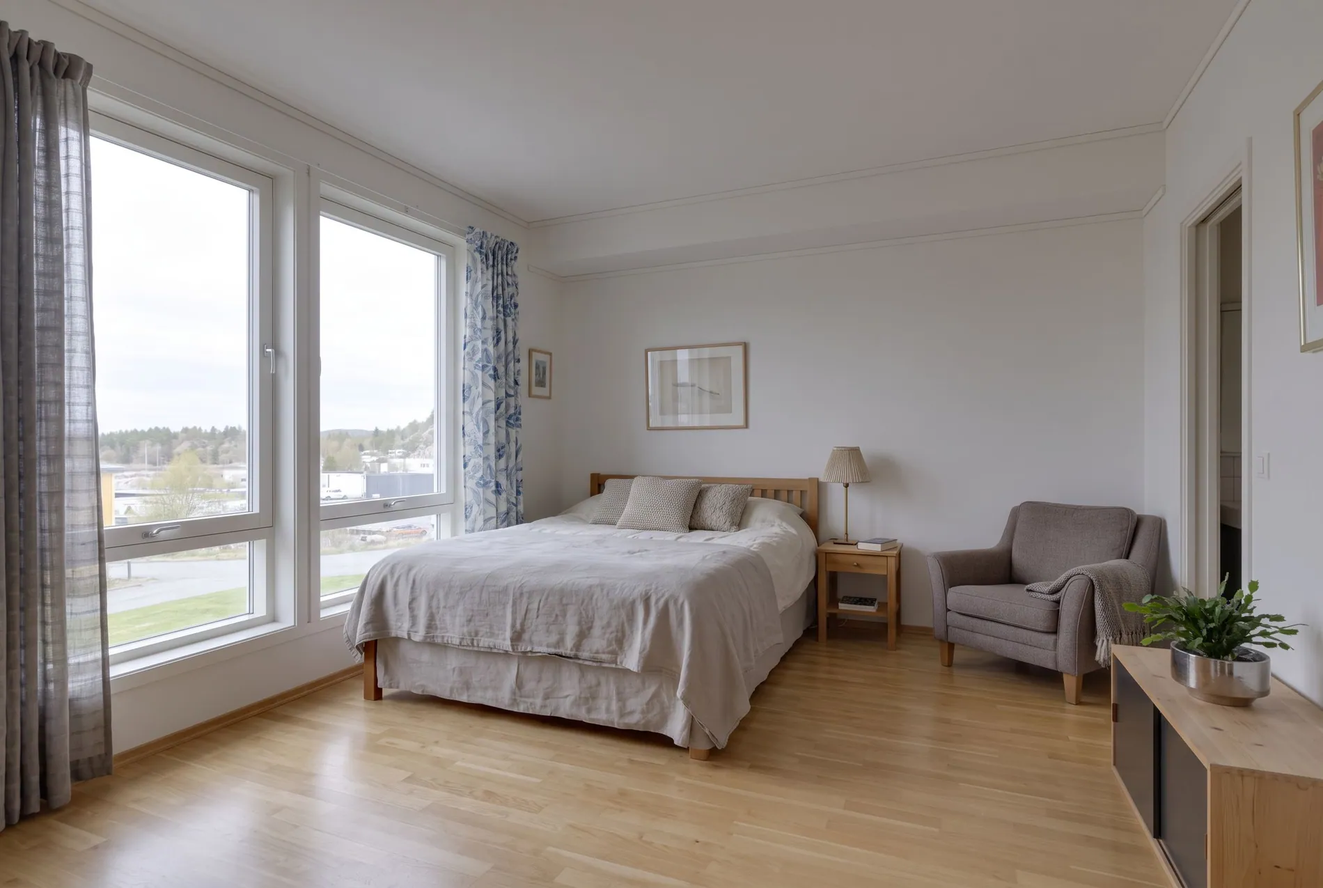 Living room window before and after an AI window pull showing the outdoor view