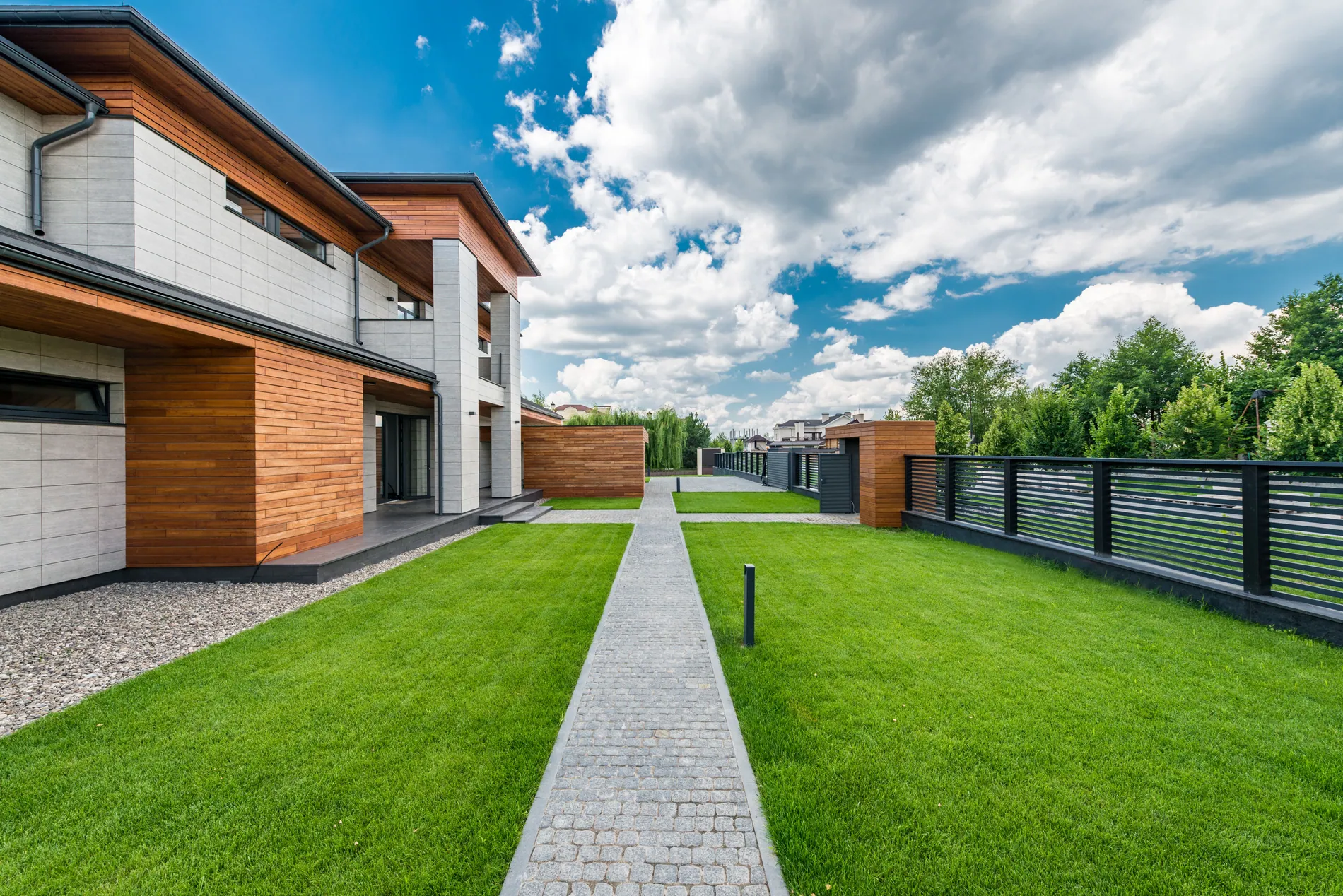 Modern house garden with dry, patchy grass before and a green lawn after AI lawn replacement by Stager AI