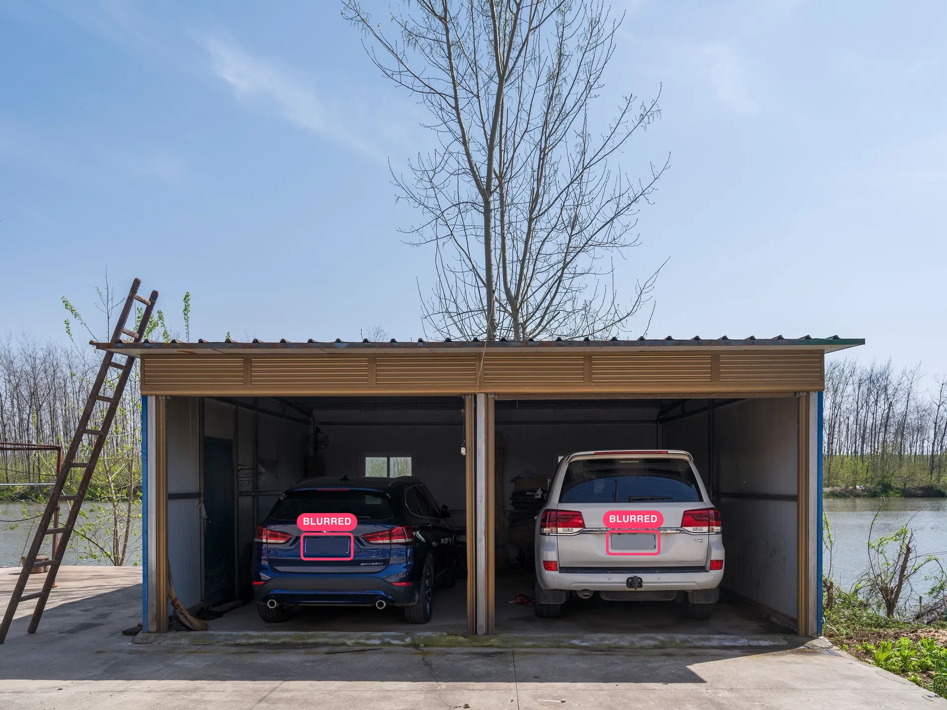 Open garage with two parked cars, rear license plates blurred by Stager AI