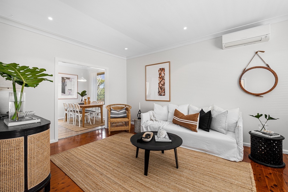 Living room staging from real photo — Stager AI vs mnml.ai