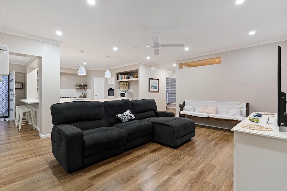 Living room AI staging — Stager AI vs Spotless Agency